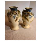 Pair of antique Japanese ceramic vases featuring molded three-clawed dragon design, 7in tall