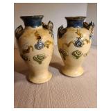 Pair of antique Japanese ceramic vases featuring molded three-clawed dragon design, 7in tall