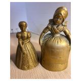 Brass Dutch girl bell with 2 boots as clapper. Other brass girl bells. Tallest is 5in.