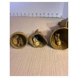 Brass Dutch girl bell with 2 boots as clapper. Other brass girl bells. Tallest is 5in.