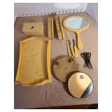 Vintage Irice mirror in leather snsp case, celluloid mirror, vanity tray, brushes, more. Some damage to tray and box.