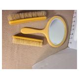 Vintage Irice mirror in leather snsp case, celluloid mirror, vanity tray, brushes, more. Some damage to tray and box.