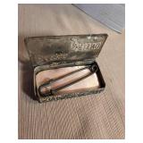 Ornate silver baby pin case