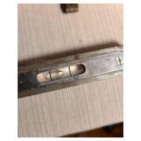 Antique Stanley 2ft folding ruler, Goodell-Pratt Co. 6in cast iron level, small ornate metal tape dispenser, ruler has been glued, see pic