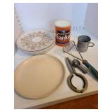 Vintage Melmac plates, Maxwell House Sanka in unopened can, kitchen utensils.