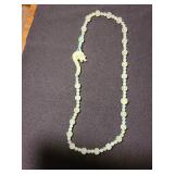 Chinese carved celadon Jade bead necklace with a dragon clasp.