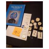 Gemstones, including reticulated quartz, amethyst, emeralds, green sapphire, garnet, more, plus a book