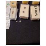 Gemstones, including reticulated quartz, amethyst, emeralds, green sapphire, garnet, more, plus a book