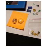 Gemstones, including reticulated quartz, amethyst, emeralds, green sapphire, garnet, more, plus a book