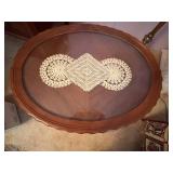 ANTIQUE OVAL WOODEN SIDE TABLE 27X21X19 W/ GLASS TOP & DOILY- UPB