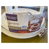 Cake Carrier and Dinosaur Cookie Cutters (both new but dusty)