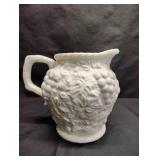 8" MILK GLASS PITCHER WITH GRAPE AND LEAF PATTERN 8" MILK GLASS PITCHER WITH GRAPE AND LEAF PATTERN