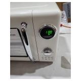 Haden 700W Compact Countertop Microwave Over Ivory powers on