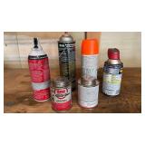 FULL TO HALF FULL GARAGE ASSORTMENT OF SPRAY CAN ITEMS AND ADHESIVE FULL TO HALF FULL GARAGE ASSORTMENT OF SPRAY CAN ITEMS AND ADHESIVE
