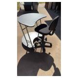 DESK ON CASTERS AND ROLLING OFFICE CHAIR DESK ON CASTERS AND ROLLING OFFICE CHAIR