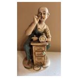 Porcelain Clockmaker Figurine Approximately 8 Inches Tall Porcelain Clockmaker Figurine Approximately 8 Inches Tall