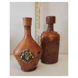Large Floral Arrangement in Ceramic Urn Vase, Dot Optic Blown Glass Vase with Greenery, and Leather Covered Decanters, and Framed Print