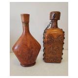 Large Floral Arrangement in Ceramic Urn Vase, Dot Optic Blown Glass Vase with Greenery, and Leather Covered Decanters, and Framed Print