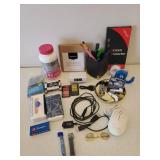 Home Office Supplies, Kleenex Travel Packs, and Bottle of Women