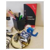 Home Office Supplies, Kleenex Travel Packs, and Bottle of Women