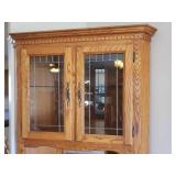 Large Oak Corner China/Sideboard Cabinet - Under Storage with 1 Silver Drawer - Lighted Top Section with Adjustable Glass Shelf and Leaded Glass Doors & Mirrored Back - 30in W x 30in L x 25in D from C