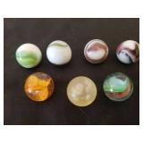 Lot of 7 Antique Glass Shooter Marbles