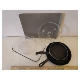 Vintage Cast Iron #8 Fire Ring Frying Pan, Pyrex 9 x 13 Baking Dish, AirBake Cookie Sheet Pan, Mini Microware Glass Tray, Farberware 8in Saute Pan, and Rival Crock Pot Lid