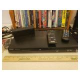 Toshiba DVD Player SD-4100, D-Link, Pair of JBL Speakers, Jawbone Jambox, Remotes, Various Connection and Power Cords, and Collection of Popular Movie DVDs with Rack