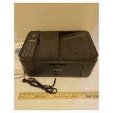 CANON MX490 Pixma Color Printer and Stack of Printer Paper