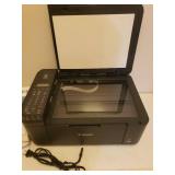 CANON MX490 Pixma Color Printer and Stack of Printer Paper