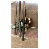 Collection of Classic Fishing Rods and Reels