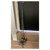 Collection of Classic Fishing Rods and Reels