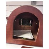 Traditional Wooden Mantel Clock with Ornate Face