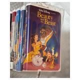 Vintage stack of VHS tapes, primarily Disney films.