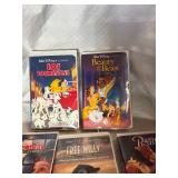 Vintage stack of VHS tapes, primarily Disney films.