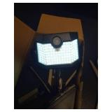 HMCITY 120 LED Outdoor Solar Lights with Motion Sensor and 3 Lighting Modes, IP65 Waterproof Wide Solar Wall Lights Ideal for Garden Patio Yard (Front Button 6Packs, Daylight White) - Retail: $28