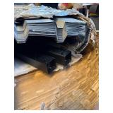 A box of corrugated metal sheeting with posts. 65 x 17