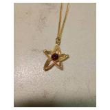 Gold Tone Star Pendant Necklace with Red Stone