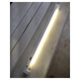 Five pieces new in box one lit up the show 4ft Commercial LED Strip Light Fixture with cord