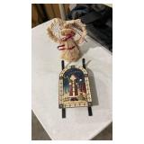 Decorative angel and ceramic and metal sleigh