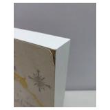 Elegant holiday featuring a leaping gold foil reindeer with silver snowflakes and calligraphic 