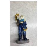 Santa Holding a Child Decorative Figurine