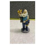 Santa Holding a Child Decorative Figurine