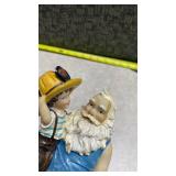 Santa Holding a Child Decorative Figurine
