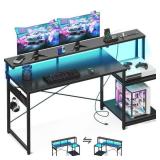 FACTORY SEALED - AODK Computer Desk, 56 Inch Gaming Desk with Led Lights & Power Outlet, Office Desk with Storage Shelves, Reversible Desk with Monitor Shelf & Headphone Hook, Carbon Fiber Black