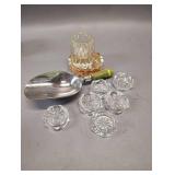 vintage cut crystal salt cellars with a diamond-faceted pattern around the sides and a sunburst design on the bottom. small, clear, faceted glass bud vase with an iridescent amber dish and vintage mea