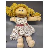 VINTAGE CABBAGE PATCH KID GIRL BLONDE HAIR BLUE EYES BESIDES A LITTLE LOVE INC ON HER FACE SHE IS STILL IN GREAT CONDITION FOR HER AGE