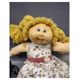 VINTAGE CABBAGE PATCH KID GIRL BLONDE HAIR BLUE EYES BESIDES A LITTLE LOVE INC ON HER FACE SHE IS STILL IN GREAT CONDITION FOR HER AGE