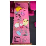 Barbie Glam Getaway House playset. This portable dollhouse unfolds to reveal a play space featuring three rooms: a kitchenette, bedroom, and en suite bathroom. With lots of accessories