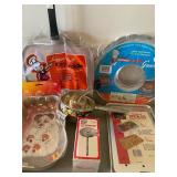 All New in Packages - Griddle, Cake Pan, Oven Guard, Thermometer, Food Mill and a Broiler